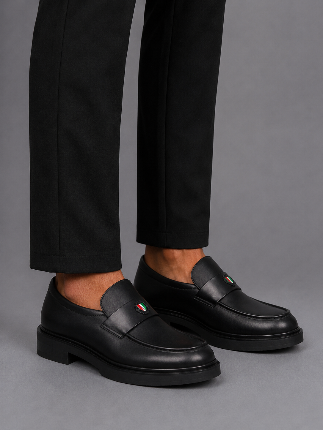 Mazerata Elia18 sleek black loafer with statement strap detail
