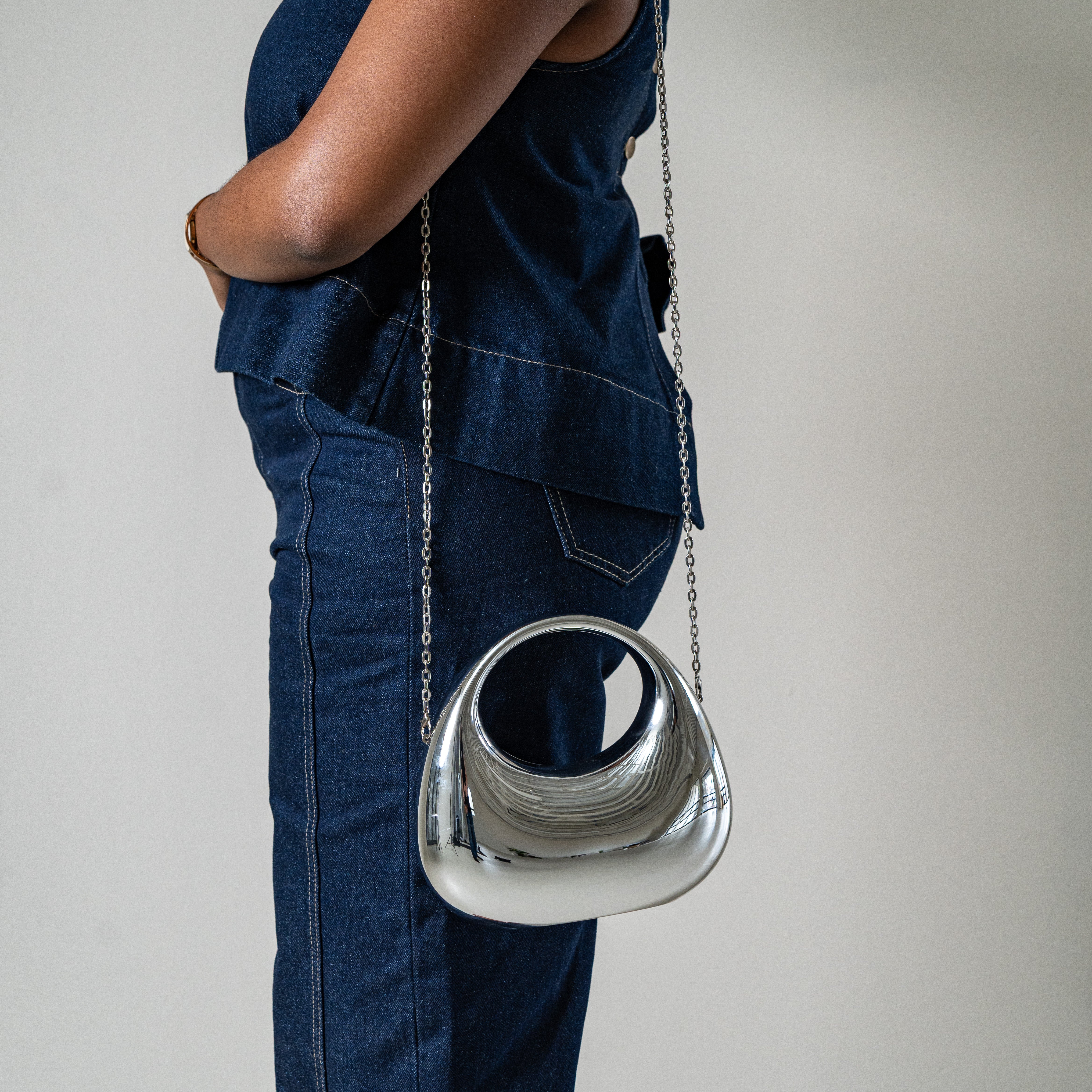 Bornite oval evening bag with top handle