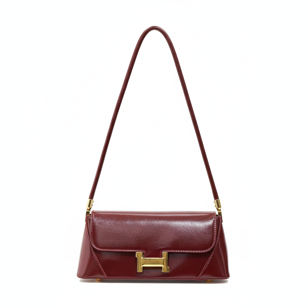 Sarcolite glossy red shoulder bag with gold buckle