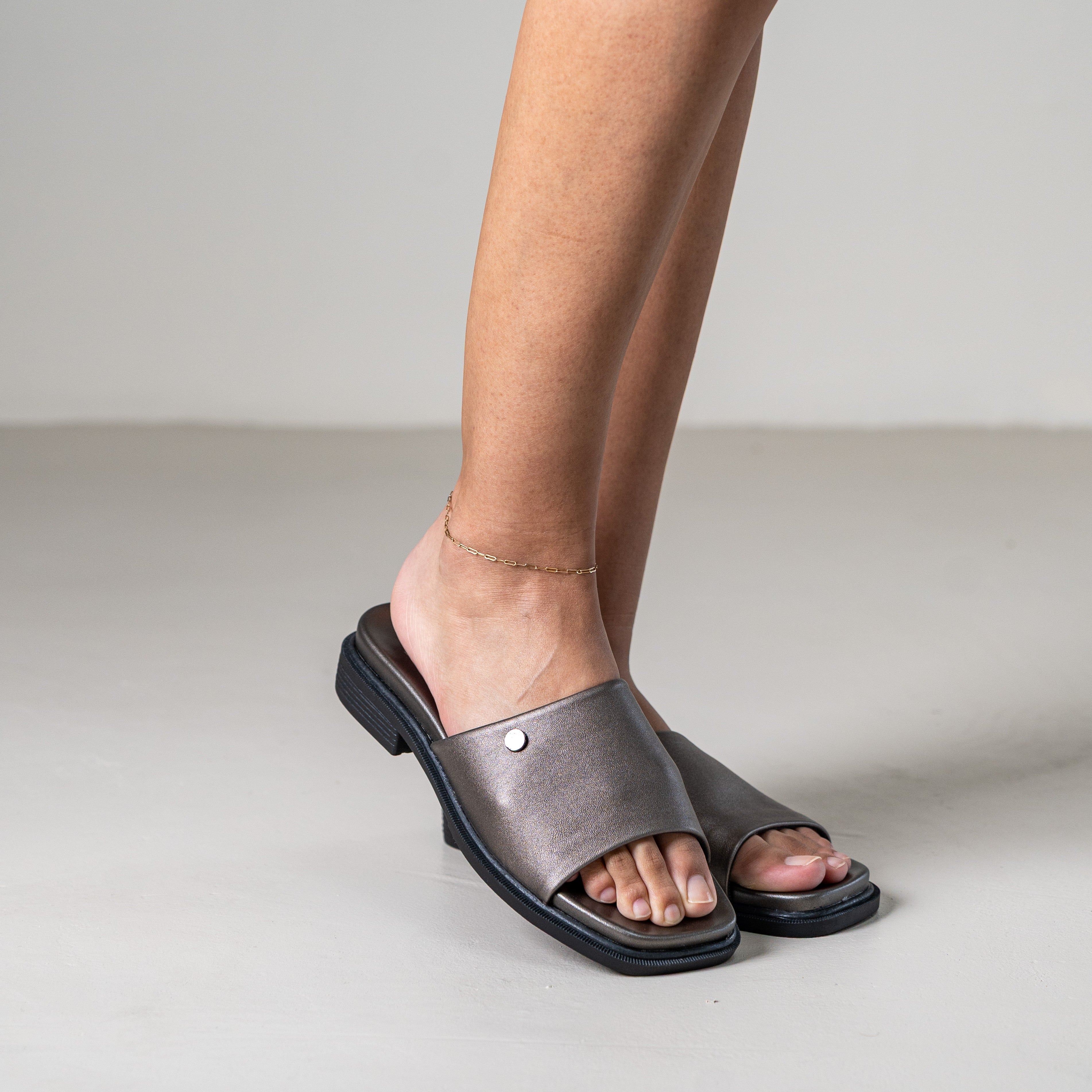 Marley slip-on sandal with front metal stud