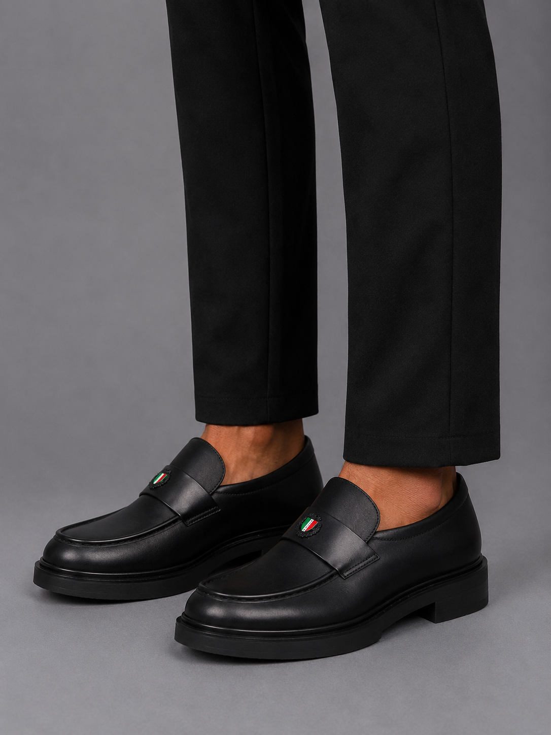 Mazerata Elia18 sleek black loafer with statement strap detail