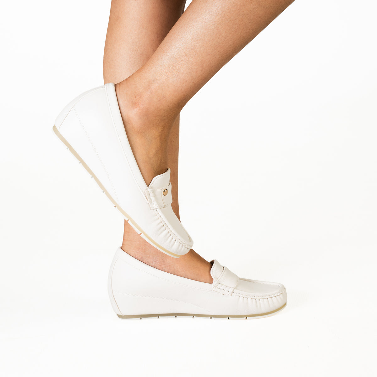 Plasma women's white loafers with elegant strap detailing and comfortable soles.