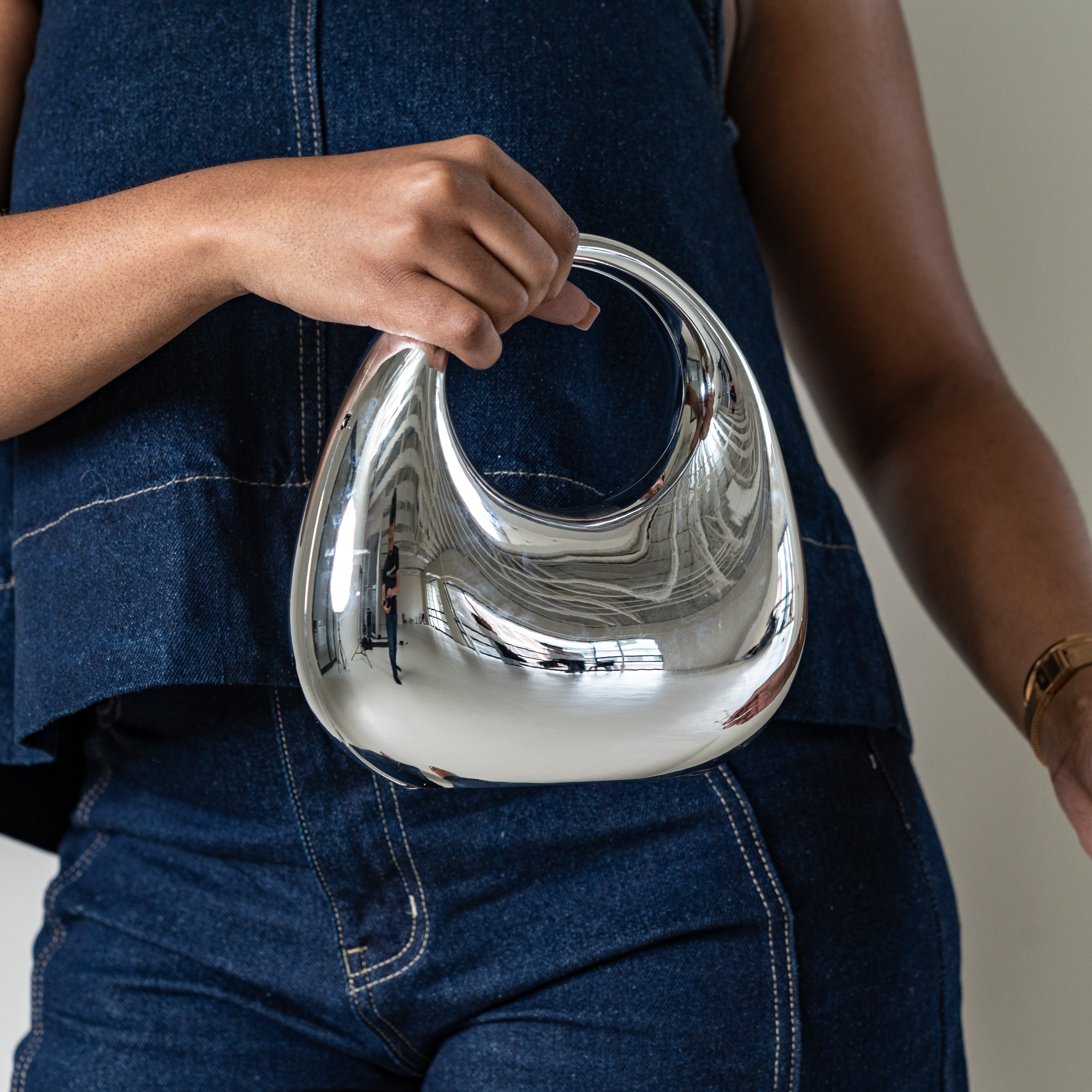 Bornite oval evening bag with top handle